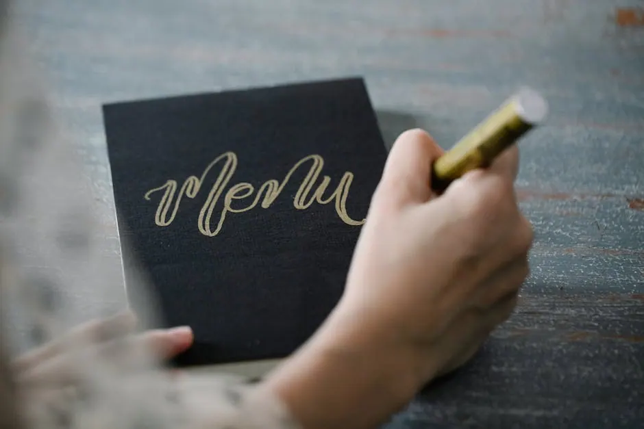 Typografie en menukaart-ontwerp op een werkblad